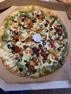 VEGAN Pesto Margherita Pizza with added olives, mushrooms and vegan chicken