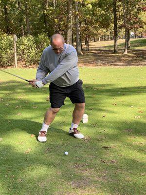 the old man teeing it up