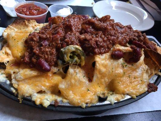 Half order of nachos with chili added.