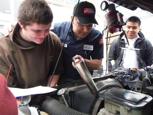 Dr Rob "The Car Doctor"  LOVES to give back and here he is showing high school kids what it takes to be a Master Mechanic! FUN TIMES