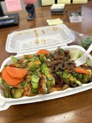 Chicken and steak with veggies, green onions and pickled carrots & jalapeños.