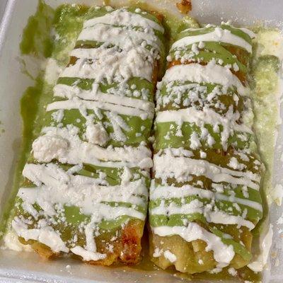 Chalita's Plate with two tamales, green tomatillo sauce, avocado sauce, sour cream, and cheese - Chalita's Tamales