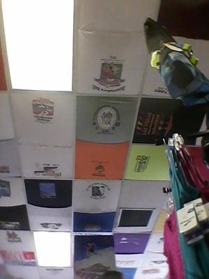 Race event t-shirts on the ceiling.