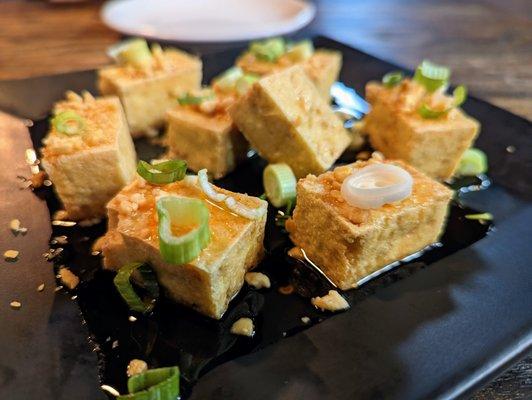 Loaded Fried Tofu. 8 pieces for $6. Fried tofu topped with peanuts, scallions, and sweet chili sauce.