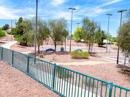 Gated area that separates the baseball quarts and the playground park area