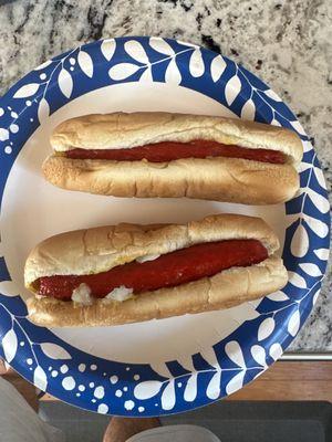 Two dogs "all the way".  (They do not supply the paper plate that was all me!)