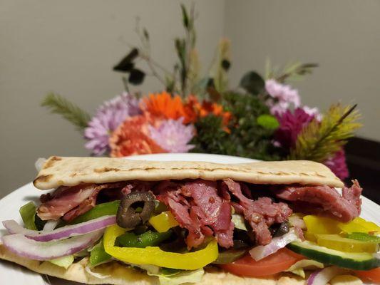 Part of our footlong pastrami on flat bread, with provolone, all the veggies, and a drizzle of honey mustard :)