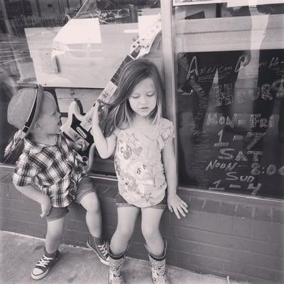 Kiddos hanging outside of the store.