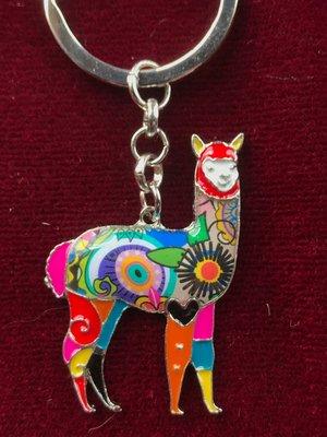 An enamel alpaca key chain.