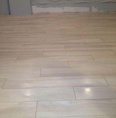 Porcelain plank tile flooring in a basement. Cherry hill,nj. Pepe tile installation