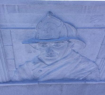 Stone carving outside the Boise police and fire departments.