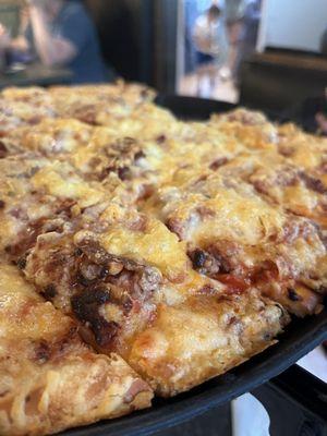 Gouda, mozzarella, sausage and bacon pizza