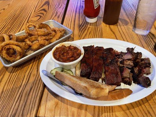 Ribs, burnt ends, beans and onion rings.