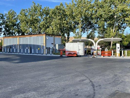 New hydrogen fuel stations on the right and the storage unit/tank/secure storage for above ground hydrogen containment on the left.