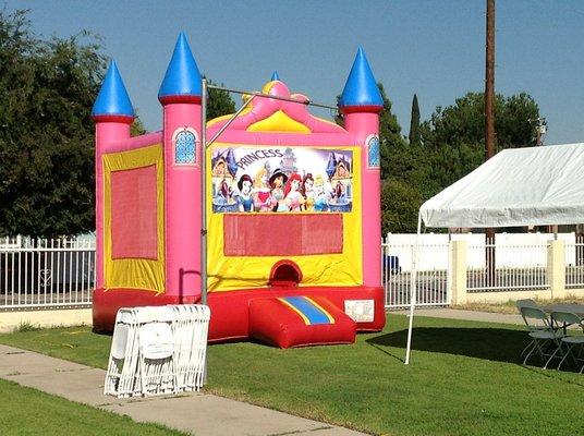 Princess castle and white folding chairs.