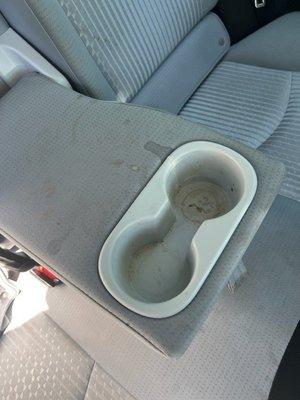 Did not even clean the back seat cup holder area