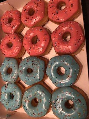 Gender reveal themed donuts . Pink and blue