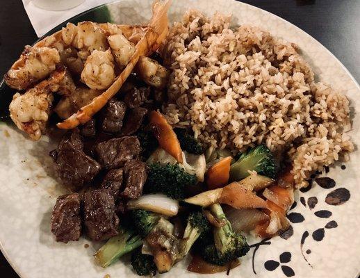 Hibachi style Lobster and Filet Mignon with vegetables and fried rice.