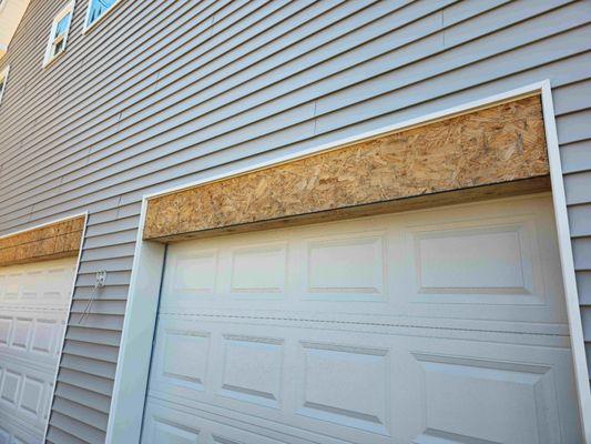 Damaged plywood and wrong size garage framing