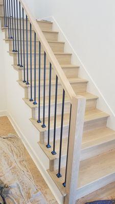 White oak with black metal balusters