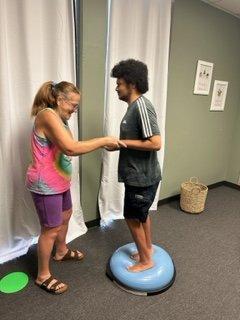 Patient working on balance and alternating steps.