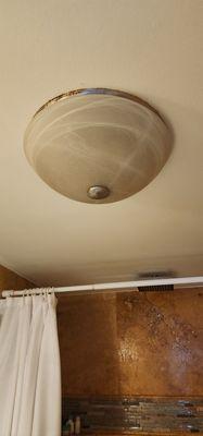 We thought it was just missing bulb. This is actually covering the exhaust fan for shower.