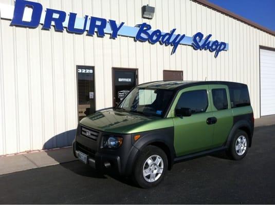 My repaired Honda Element outside the shop.