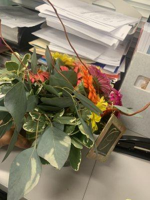 Robyn's Nest.... arrangement was lacking finesse. Flowers and foliage are damaged. This just arrived at my office within the hour.