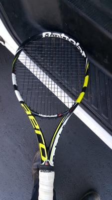 Picking up my son rackets.