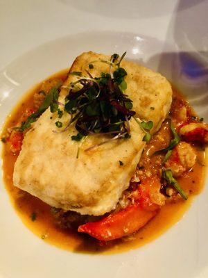 Halibut atop lobster meat in tomato broth