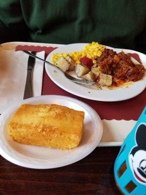 Roasted potatoes, corn, and bbq pulled pork.