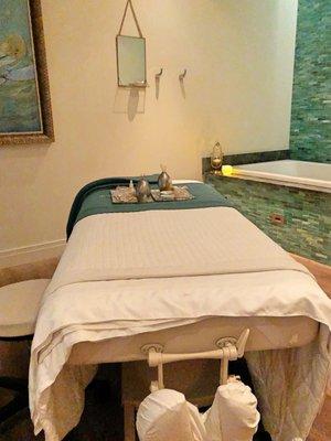 Therapy room with massage table.