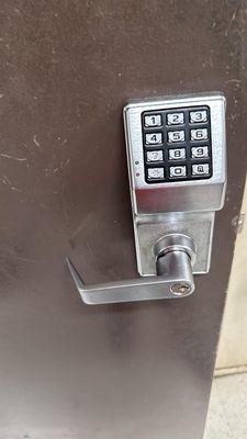 Simplex lock installed on a hollow metal door.