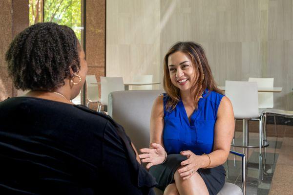 Attorney Melody Fox engaging with a client, offering compassionate guidance and legal expertise.