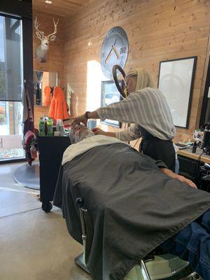 A barber doing a shave