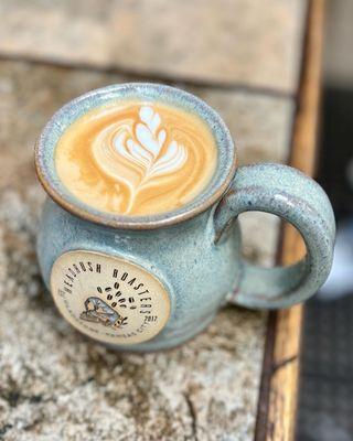 Headrush signature latte in a stoneware mug