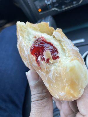 Glazed donut with raspberry filling