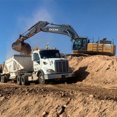 One of our trucks getting loaded by one of our excavators in Gilbert, AZ.