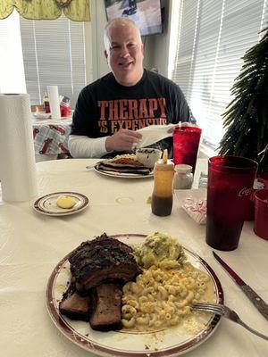 BBQ ribs, brisket, sausage, Mac n Cheese, potato salad, and greens