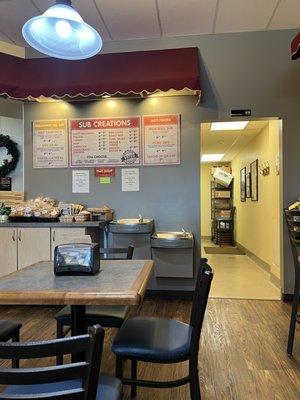 Small seating area for breakfast, subs, or daily specials