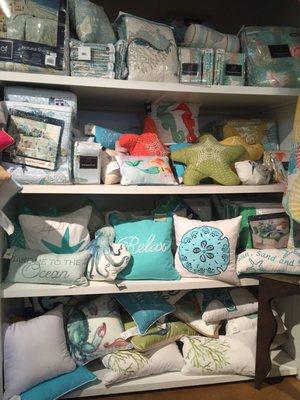 There are a lot of beautiful linens and fun throw pillows here.