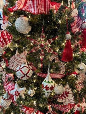 Beautifully decorated traditional red, white and green Christmas tree.