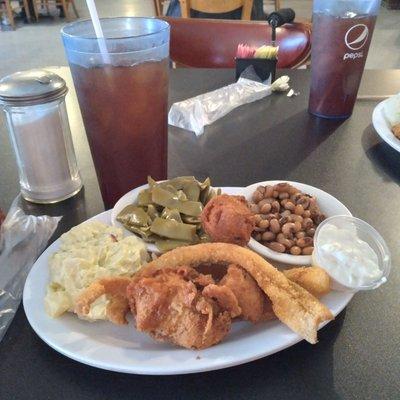 Catfish,  black-eyed peas, green beans, potato salad,  and hush puppies.