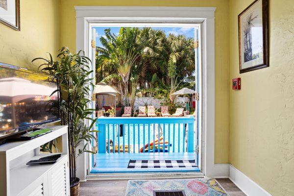 French doors open to the pool area