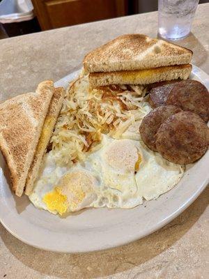 Trucker's Special with all sausage patties (three eggs cooked OM, hash browns, sourdough toast)