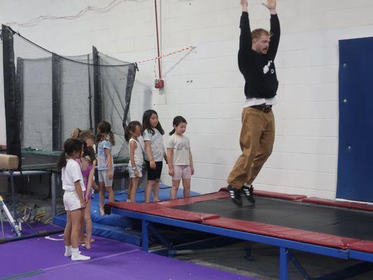 Coach James leads the birthday celebration group in fun pre-lunch gym time.