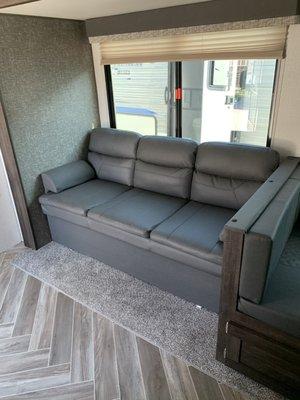 Couch with storage underneath and pulls to be a bed