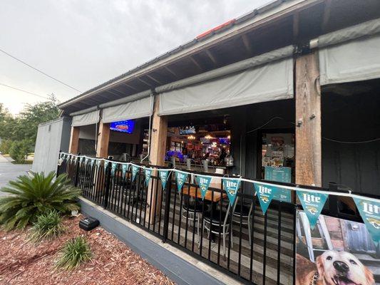 Outside seating, with bar area looking inside the restaurant