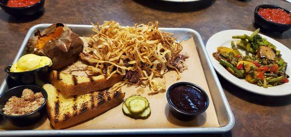 Pulled pork dinner with baked sweet potato and grilled veggies.