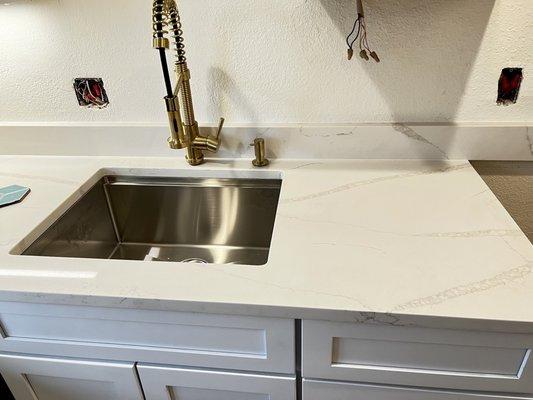 Kitchen sink area countertop.